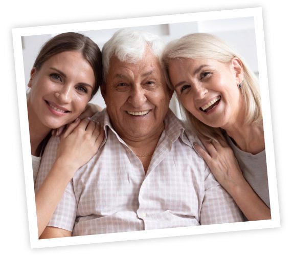 smiling adult daughter with senior parents